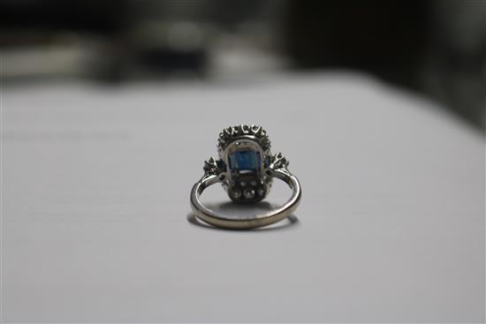 An Art Deco style white metal, sapphire and diamond ring, size M.